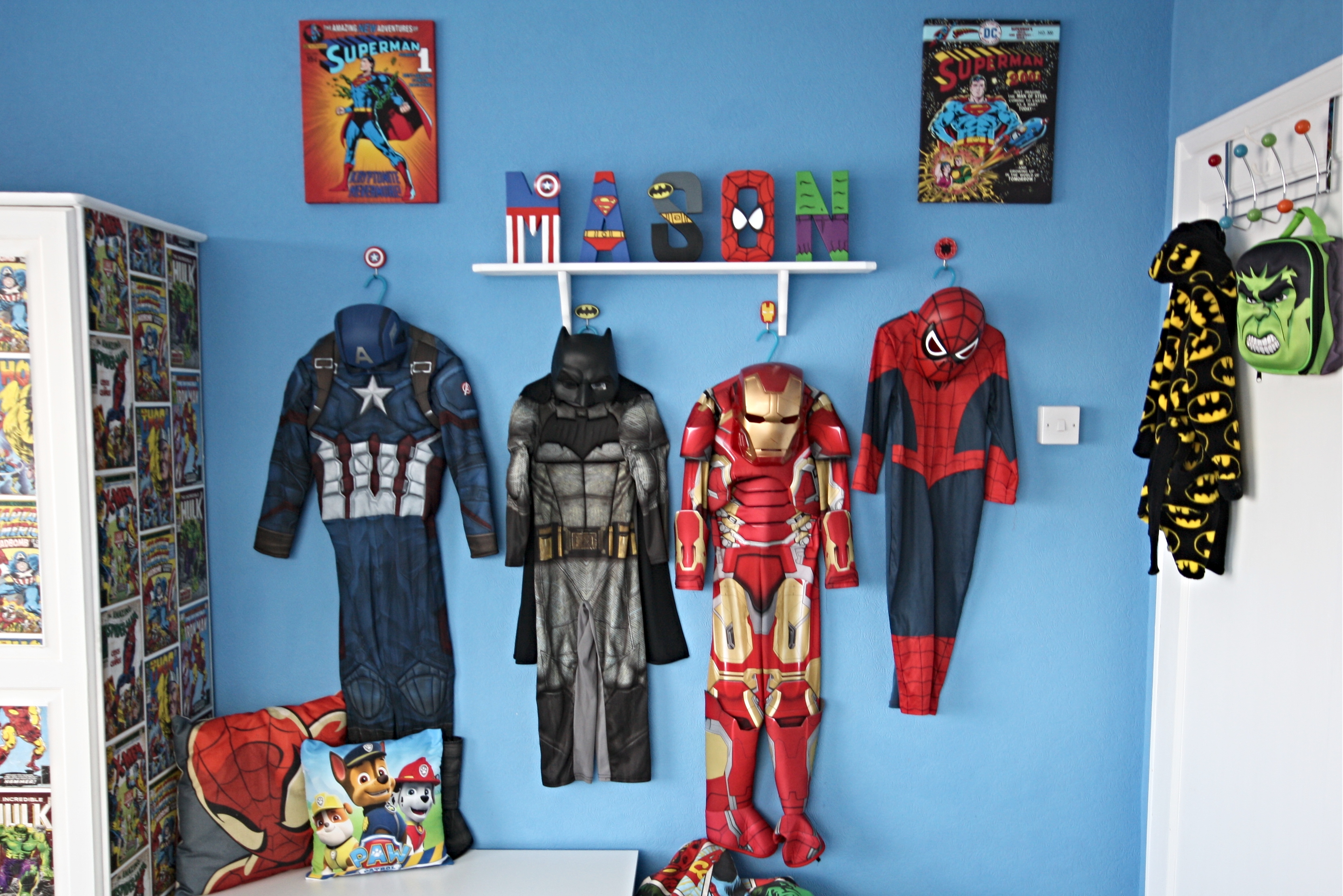 close up of hero up superhero costume display station