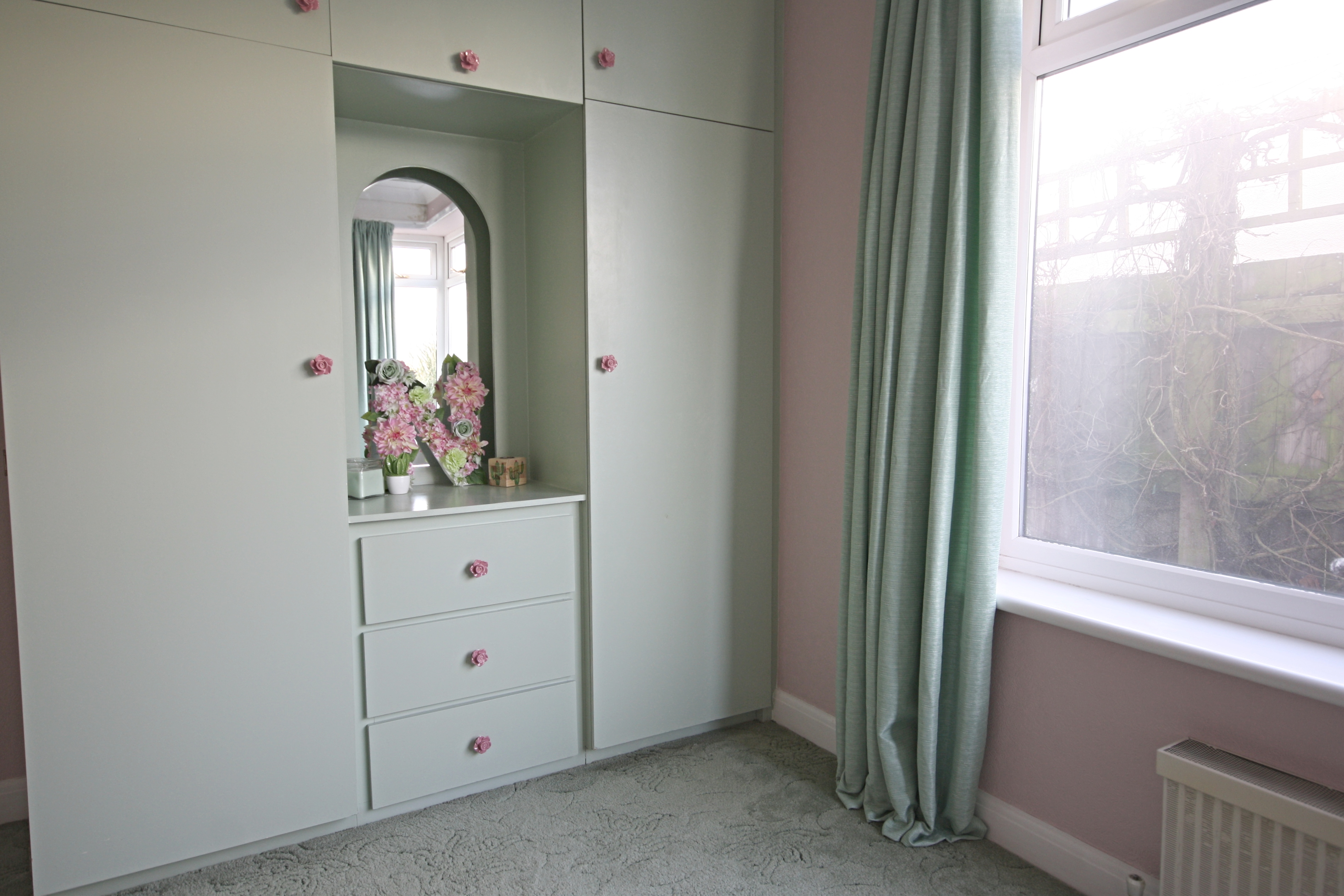 Pink and green painted melamine wardrobe