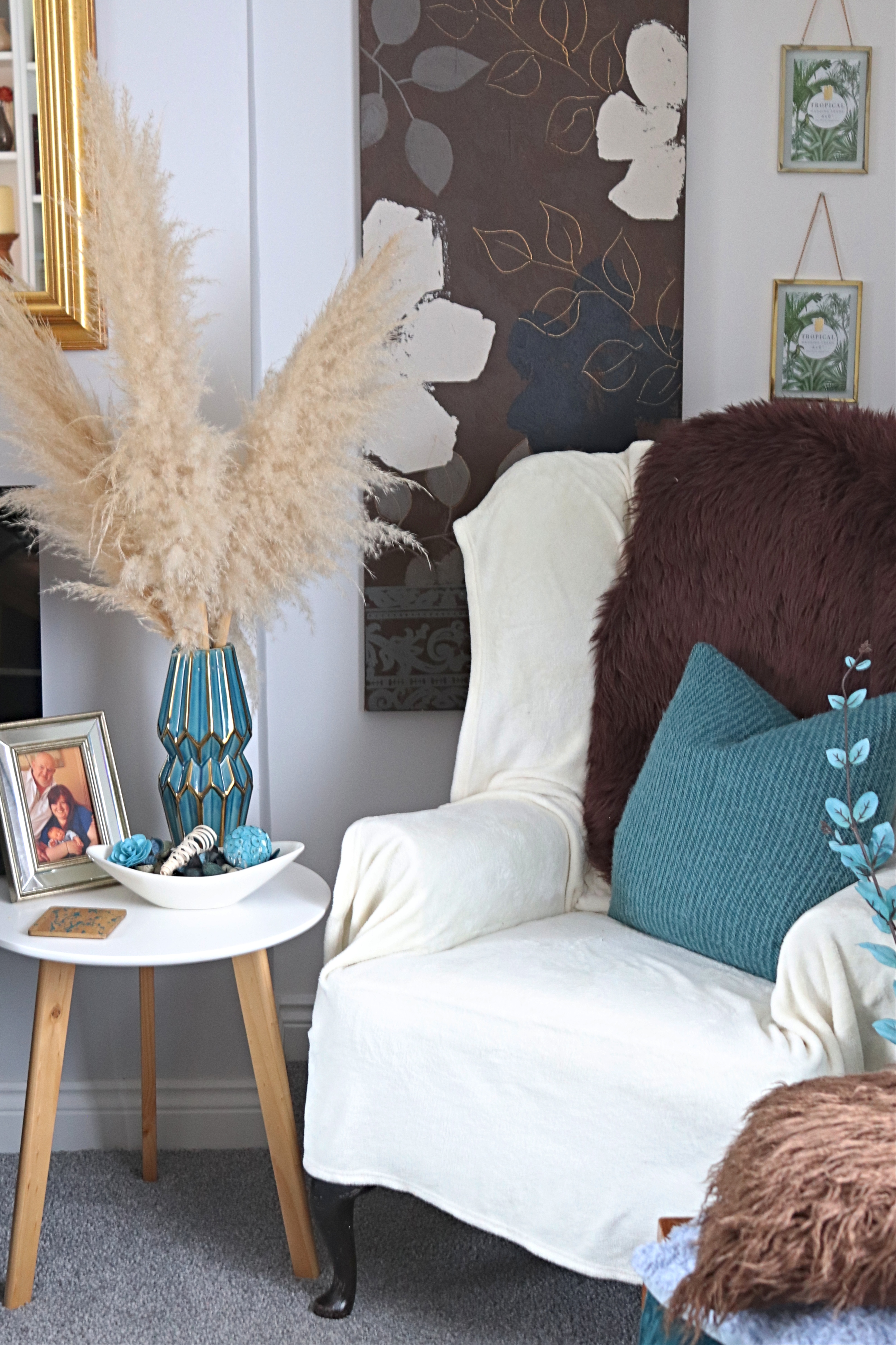 corner of living room with pampas grass and wing back chair