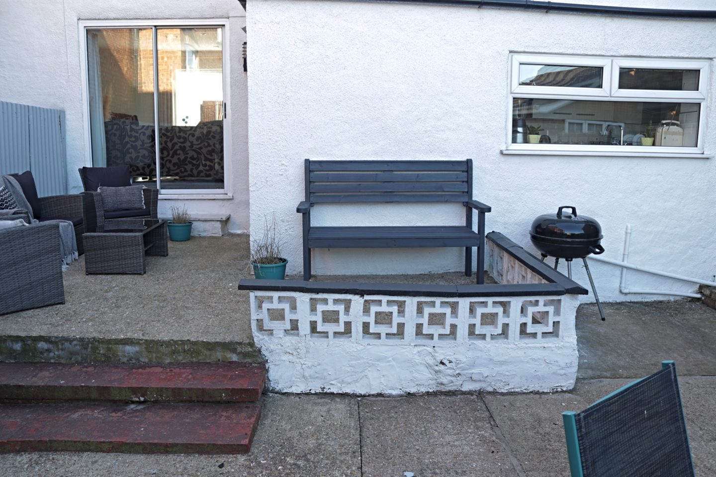 back view of the house and patio after painting