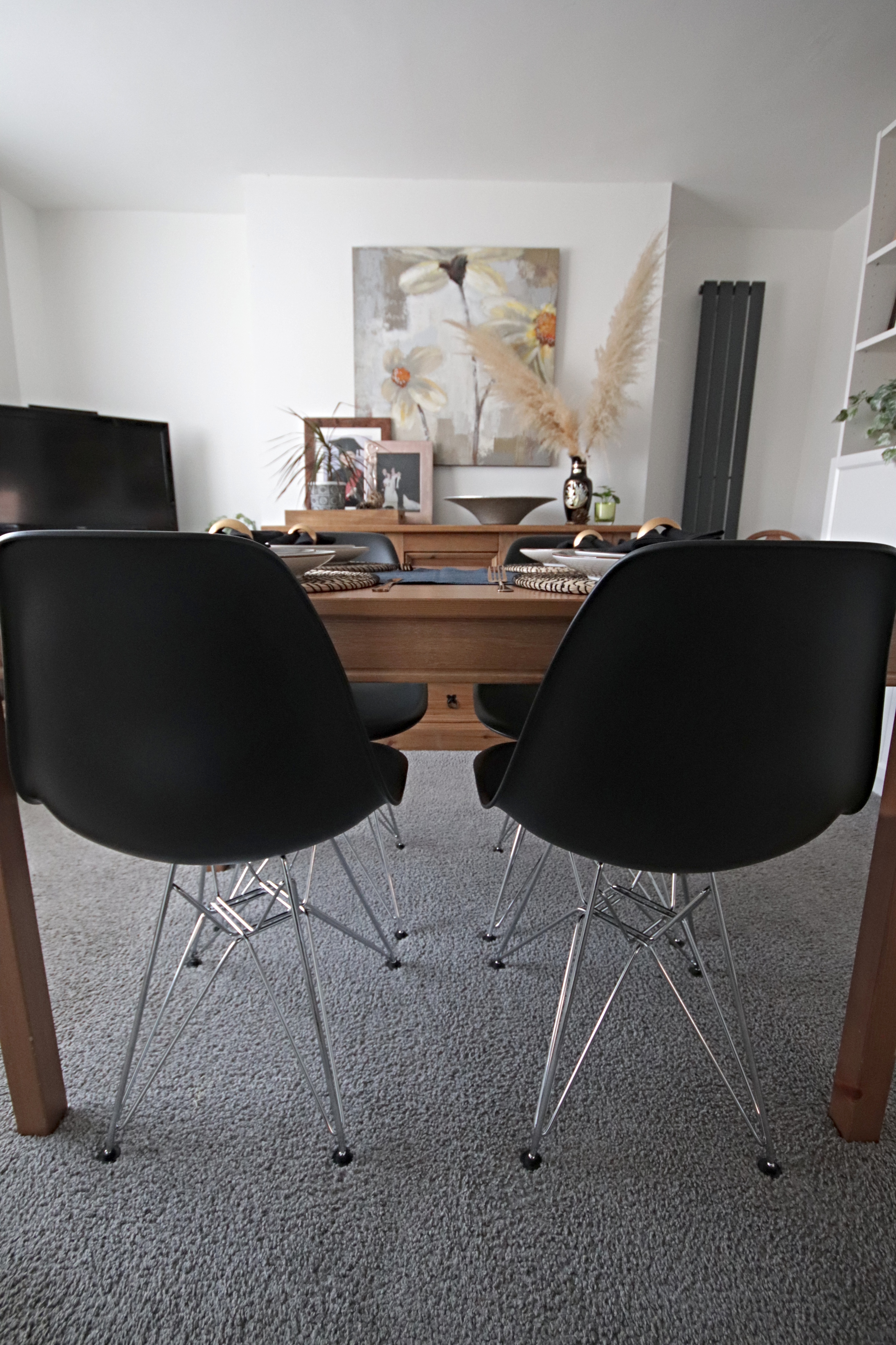 Dining room update including new Eames replica chairs and an ikea billy bookcase hack