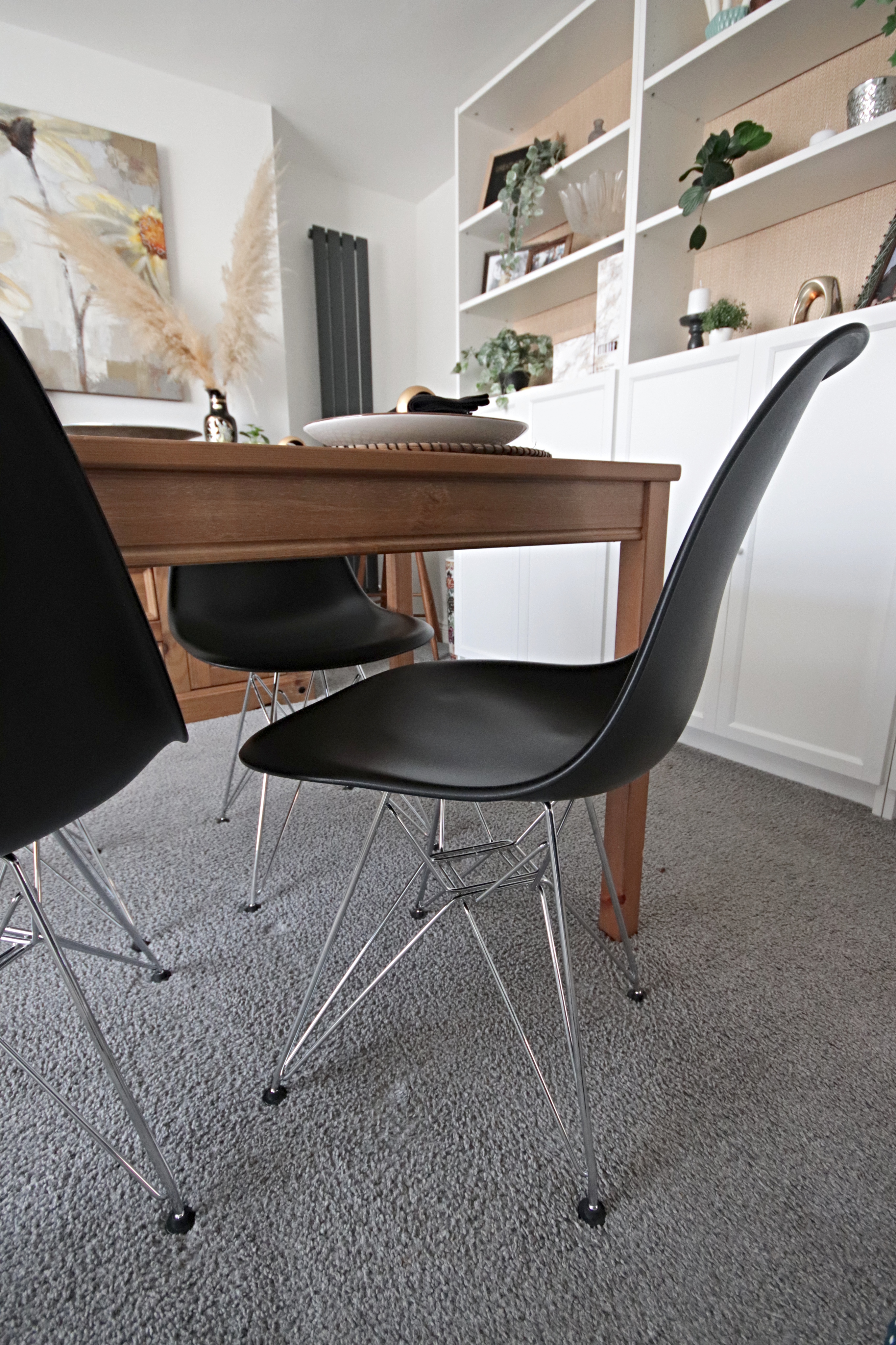 Dining room update including new Eames replica chairs and an ikea billy bookcase hack