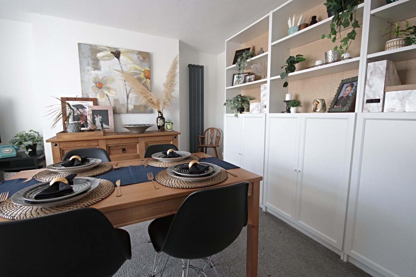 Dining room update including new Eames replica chairs and an ikea billy bookcase hack