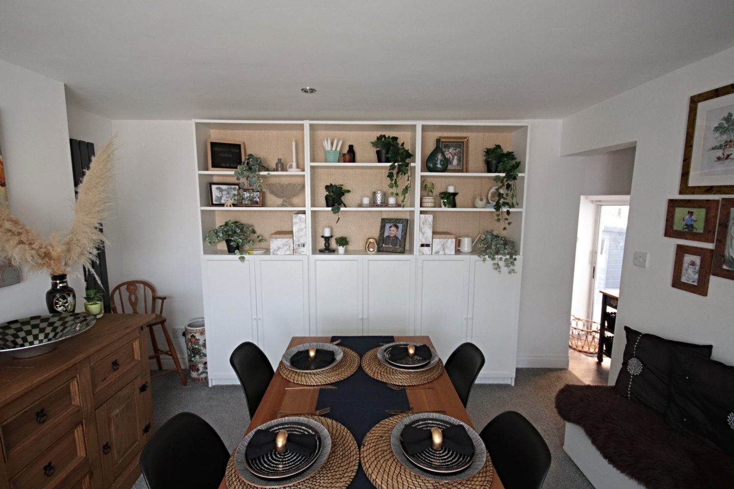 Dining room update including new Eames replica chairs and an ikea billy bookcase hack